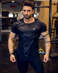 GeToday muscle fit performance gym t-shirt, close-up of black athletic T-shirt showing slim fit and breathable fabric details.