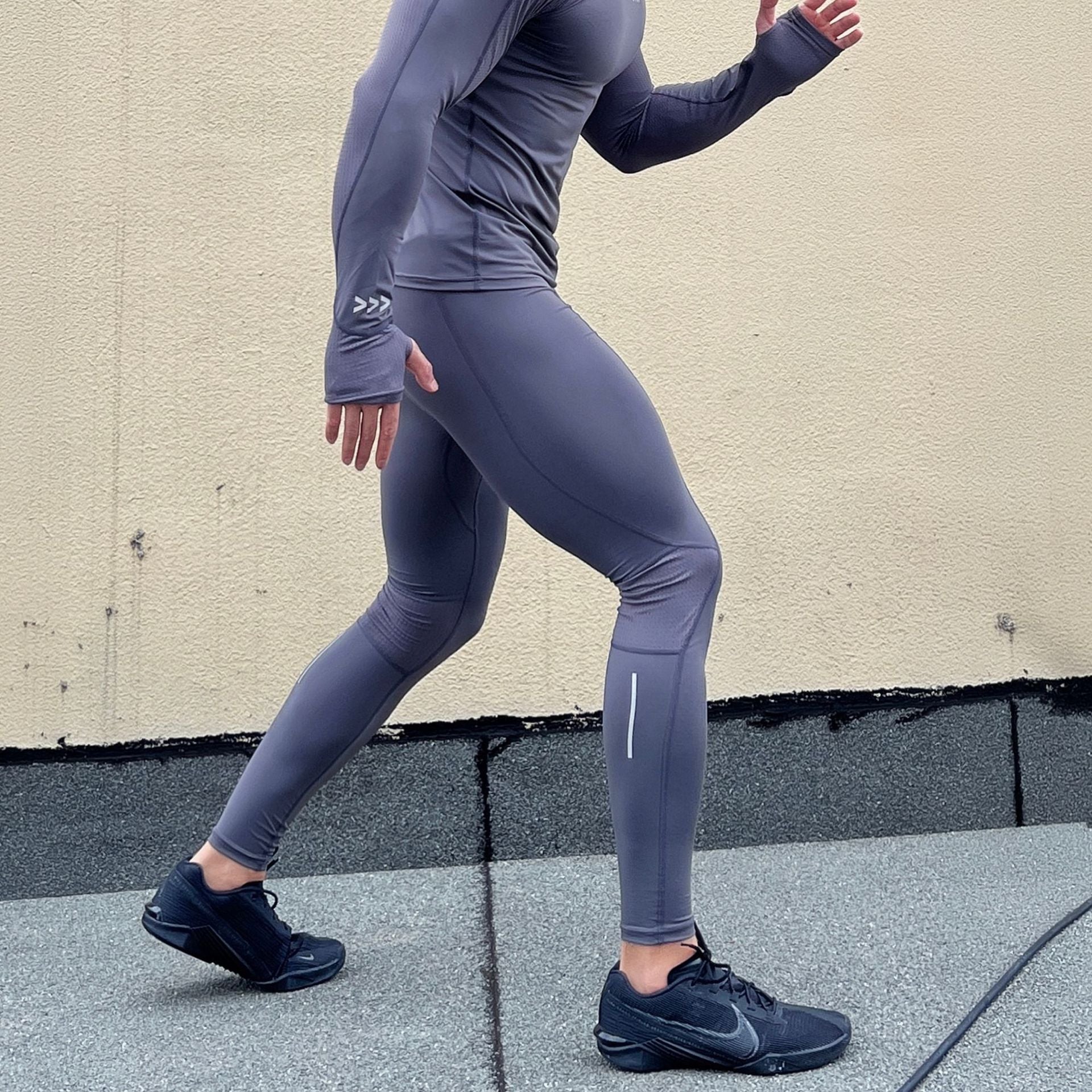 Men's quick-drying, high-elastic training tights by Pump Lab Fitness, showing a close-up of the stretchy, moisture-wicking fabric.