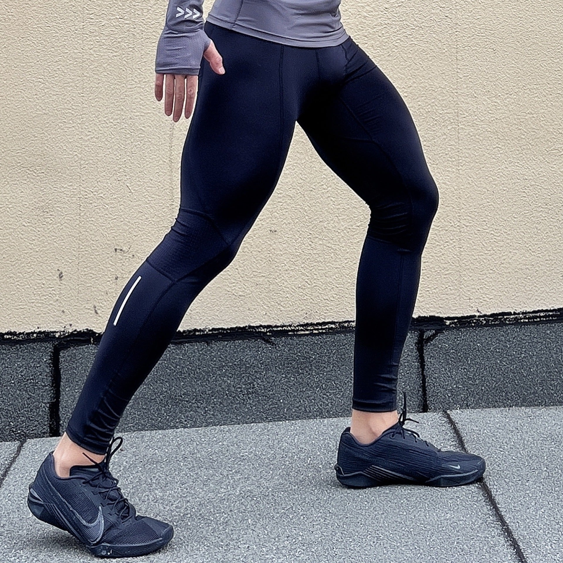 Men's quick-drying, high-elastic training tights by Pump Lab Fitness, shown in black, designed for workout flexibility and comfort.