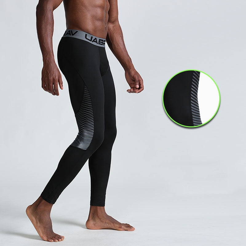 Men's compression sports leggings by Pump Lab Fitness, close-up view showing stretchy, tight-fitting athletic tights for men.