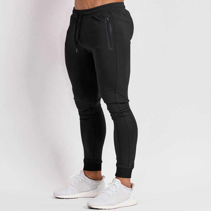 Men's slim fit joggers for training and running by Pump Lab Fitness, shown in dark athletic fabric with a tapered design.