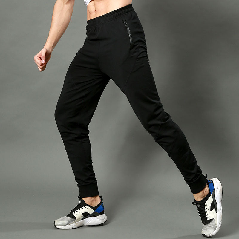 Men's slim fit jogger pants by Pump Lab Fitness, designed for spring and summer gym workouts, shown in dark athletic fabric.